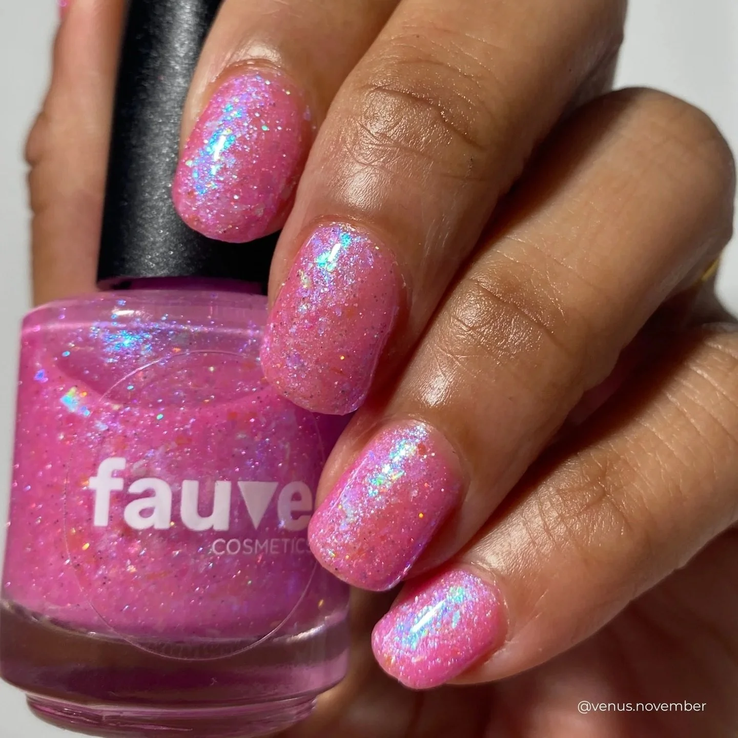 LOTUS PETALS
Bubblegum pink jelly base, aqua/blue/violet/lime/gold iridescent flakies, blue/violet micro iridescent flakies, silver holo, pink/aqua reflective glitter

Swatched by @venus.november 
Paid PR

#fauvecosmetics #nailpolish #glitternails #p