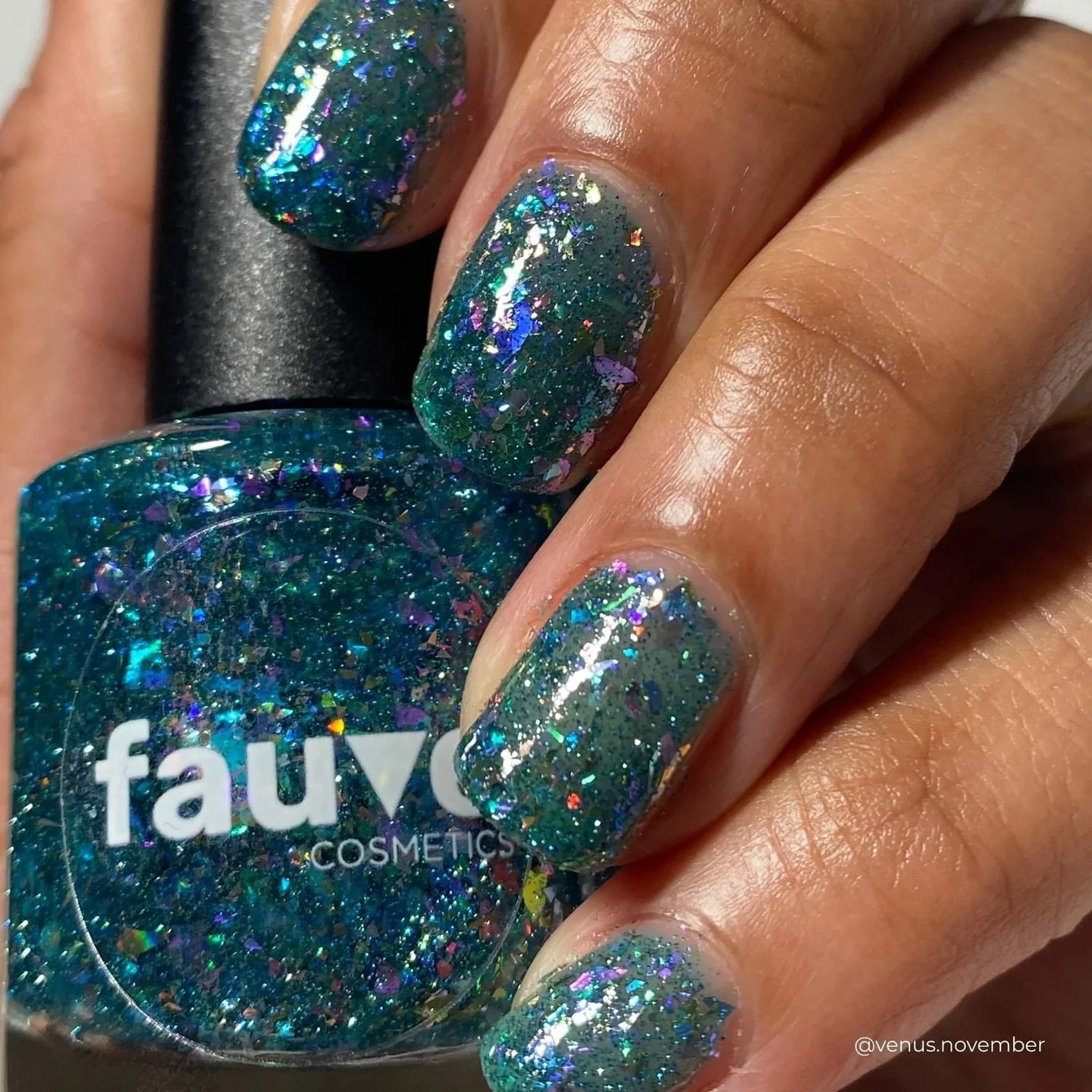 BLUE NYMPHEAS
Teal jelly base, teal/purple color shifting flakies, violet/pink/orange iridescent flakies, sage and pink holo flakes, blue reflective glitter

Swatched by @venus.november 
Paid PR

#fauvecosmetics #nailpolish #glitternails #tealnails #