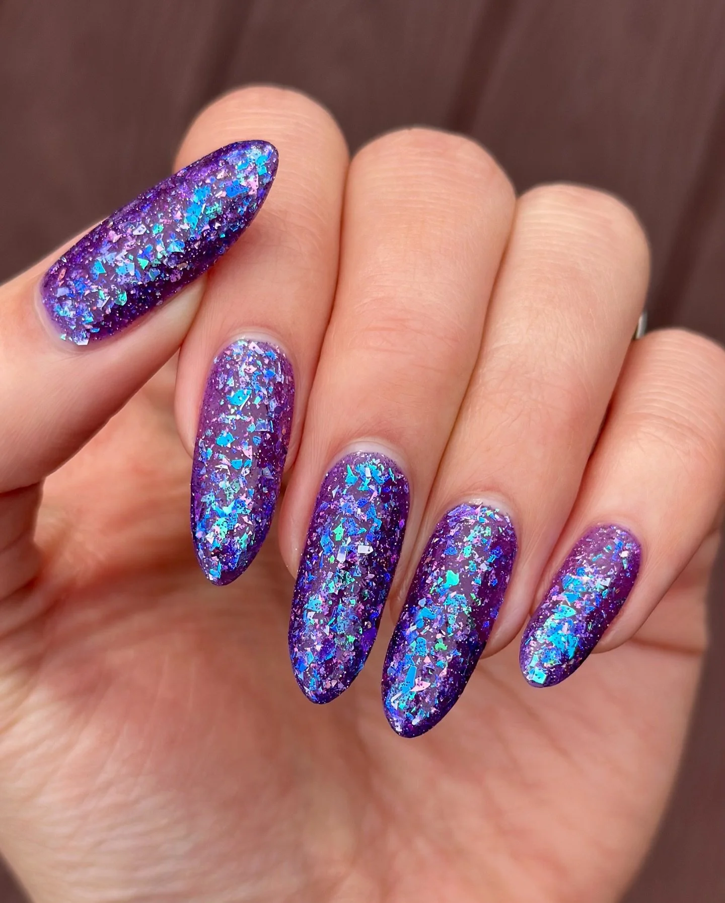 TWILIGHT BLOOMS
Purple jelly base, teal/purple &amp; blue/violet/purple color shifting flakies, violet holo micro shreds, denim blue and pink holo flakes, purple reflective glitter

Swatched by @numerousbeesnails 
Paid PR

#fauvecosmetics #nailpolish