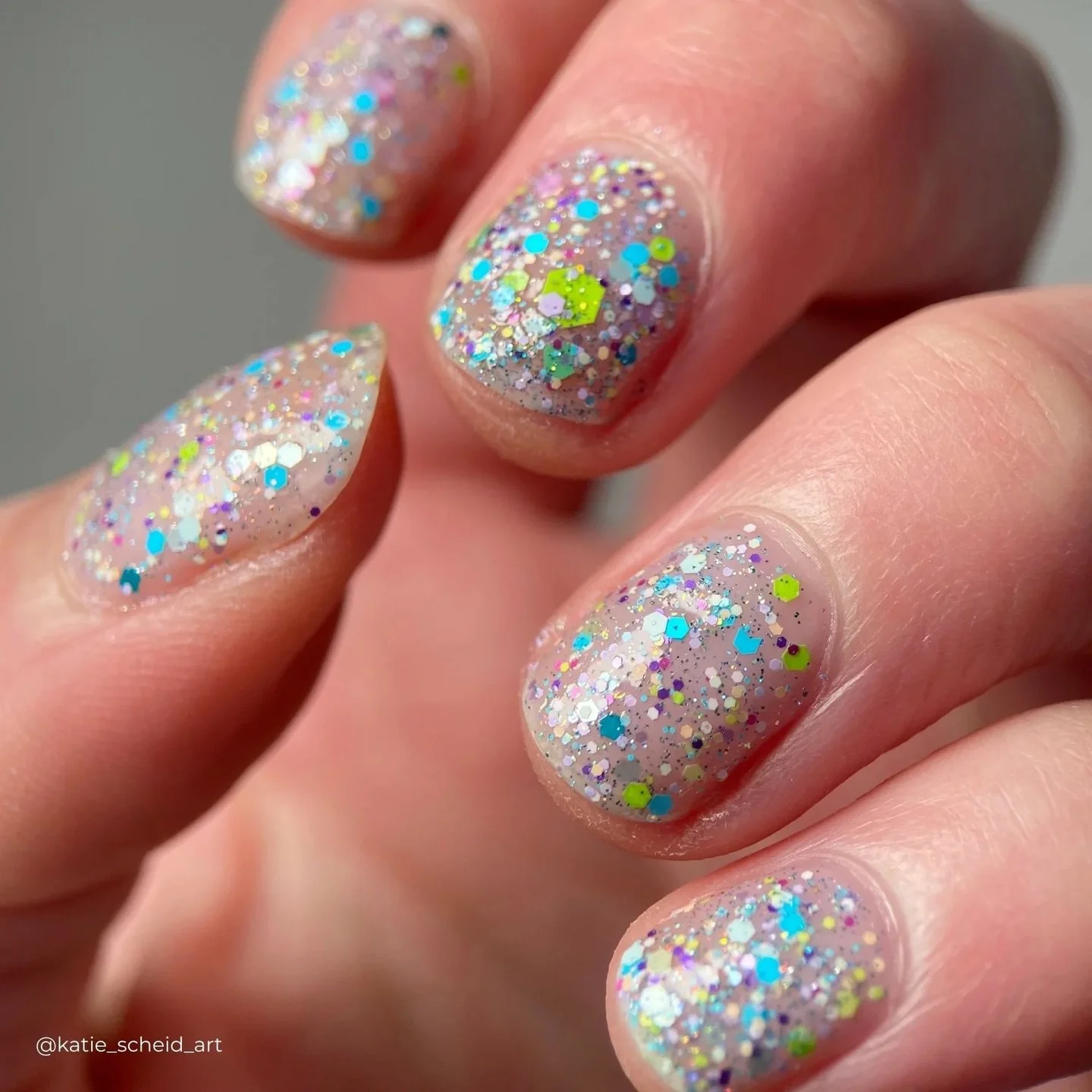 POINTILLISM 

A clear base filled with a variety of aqua, blue, purple, pink, green matte glitters in various sizes, orange/gold/green reflective glitter, and dainty holo.

Can be worn solo in 2-3 coats or layered over another polish in 1 coat as a t