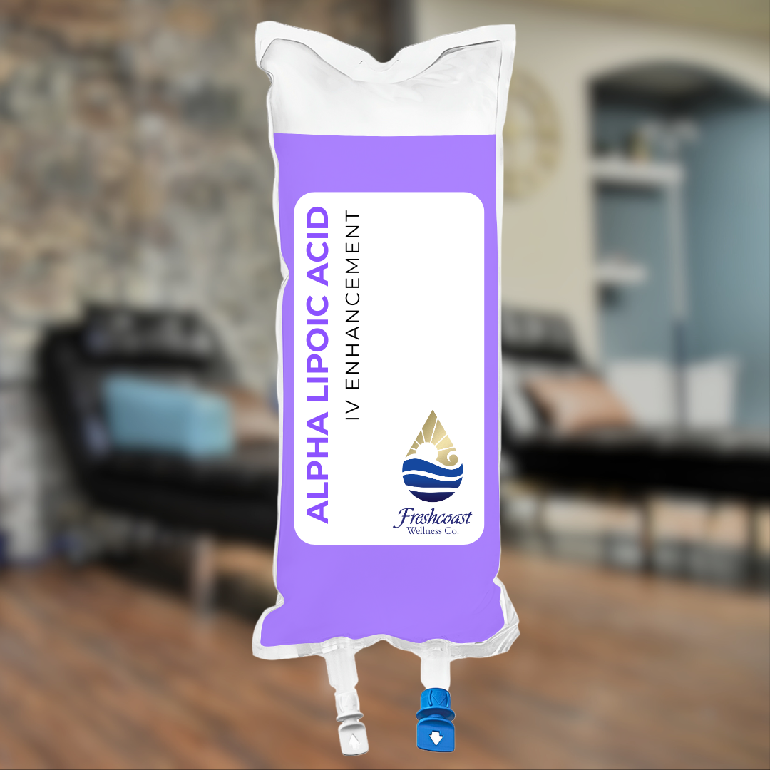 IV infusion bag labeled "Alpha Lipoic Acid, IV Enhancement" from Freshcoast Wellness Co., with a purple and white color scheme, hanging in a medical setting.