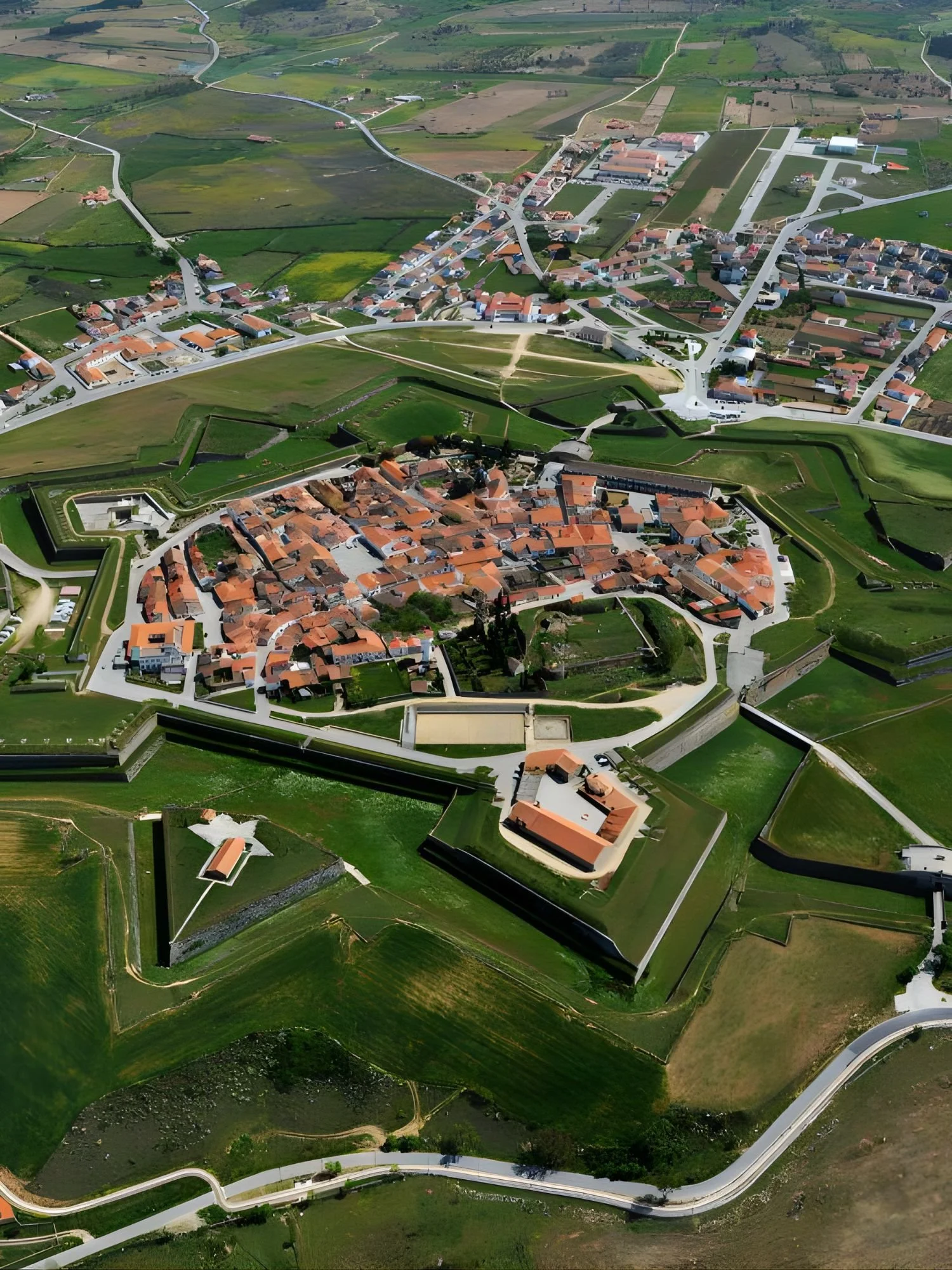 Aerial view of Almeida’s star-shaped fortress, showing the perfectly preserved fortified walls surrounding the historic village, set within the rural landscape of eastern Portugal.