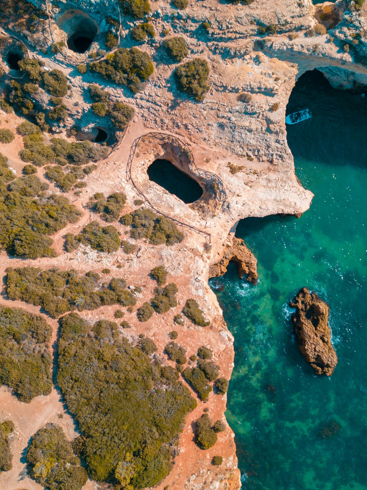 drone shot of a rocky coast of algarve, portugal