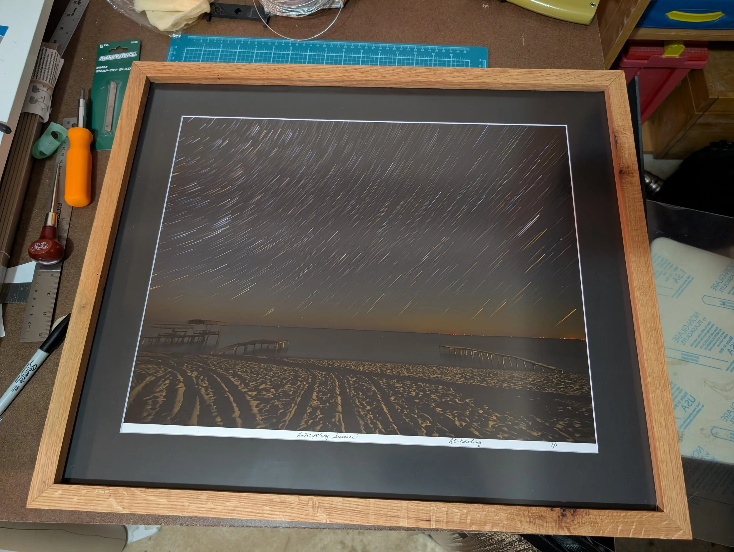 A finished piece on our framing table.