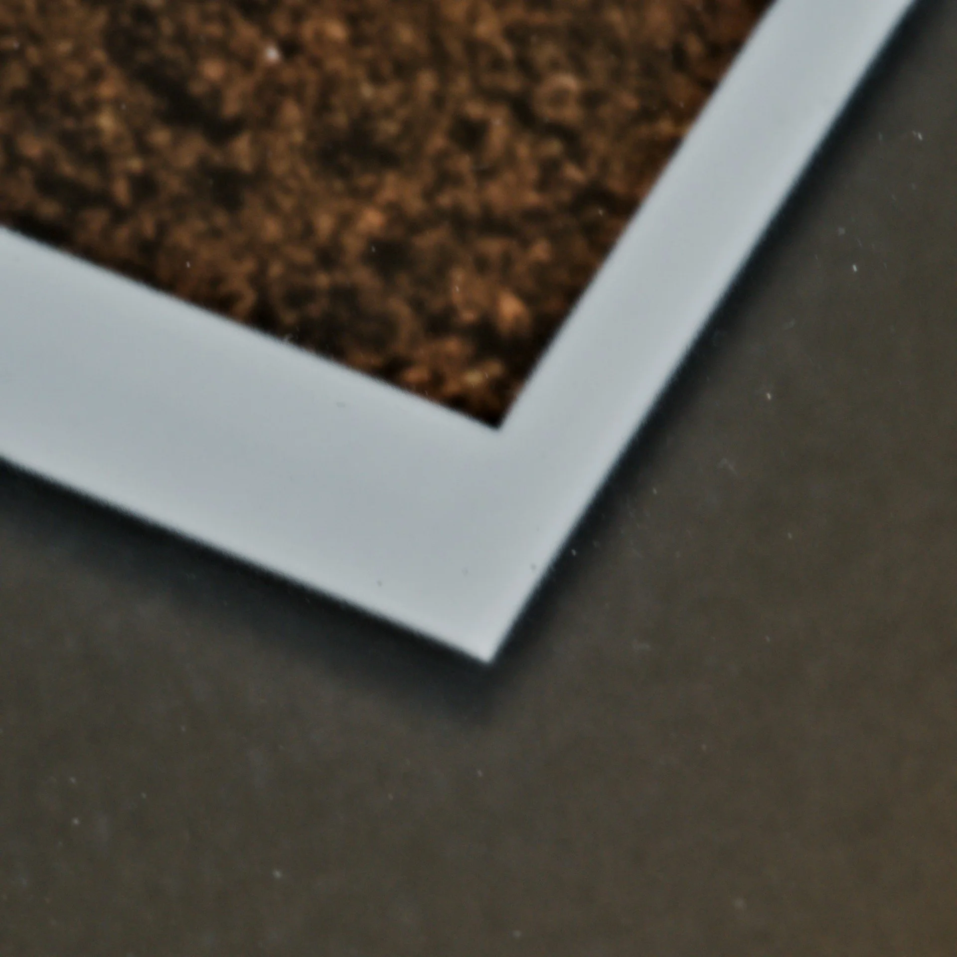 Corner detail of a float-mounted photo.