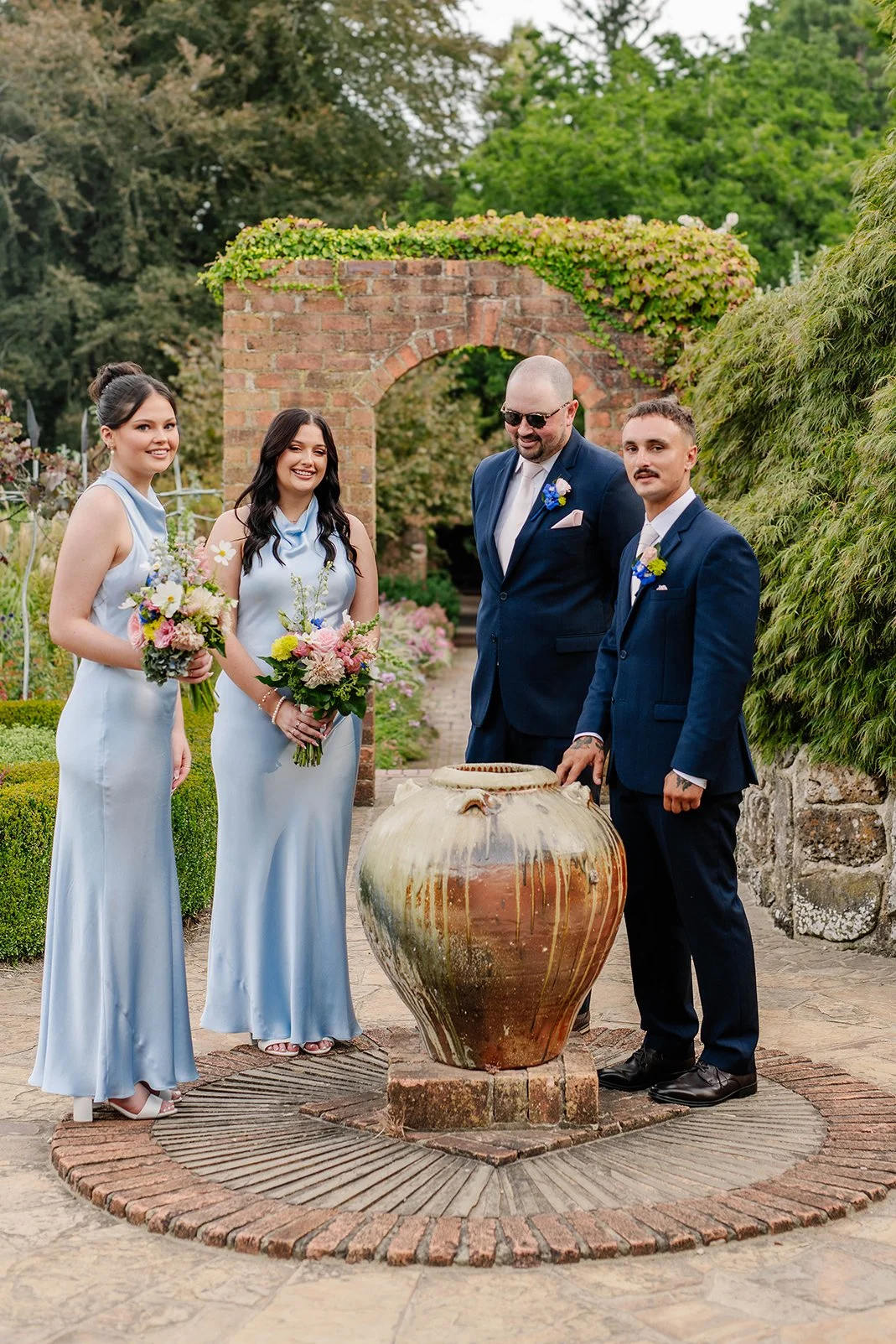 bridal-party-candid-pot-arch-cloudehill-gardens.jpg