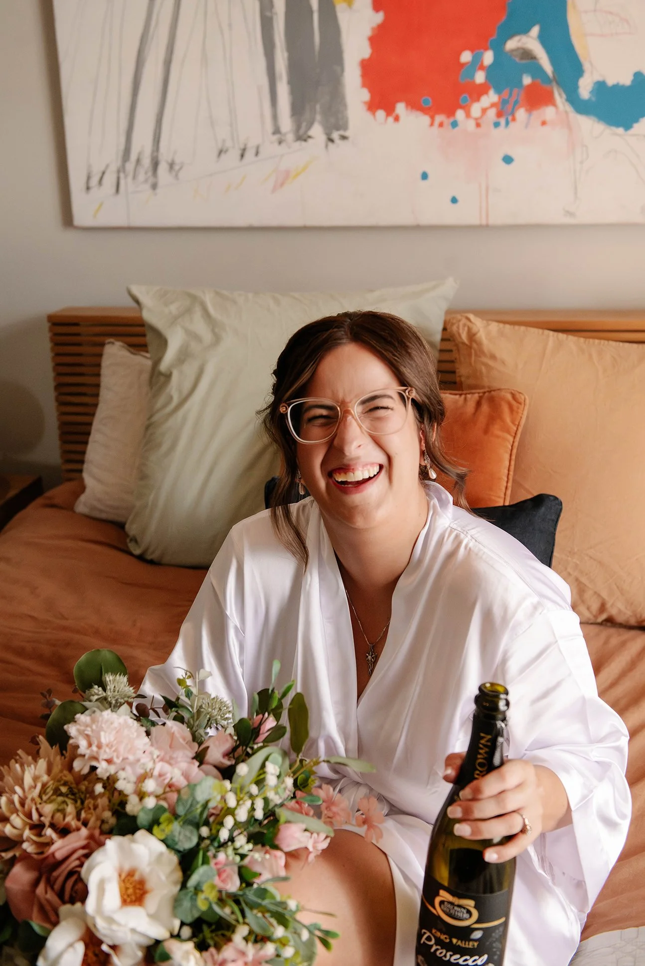 bride-laughs-robe-champagne-bendigo.jpg