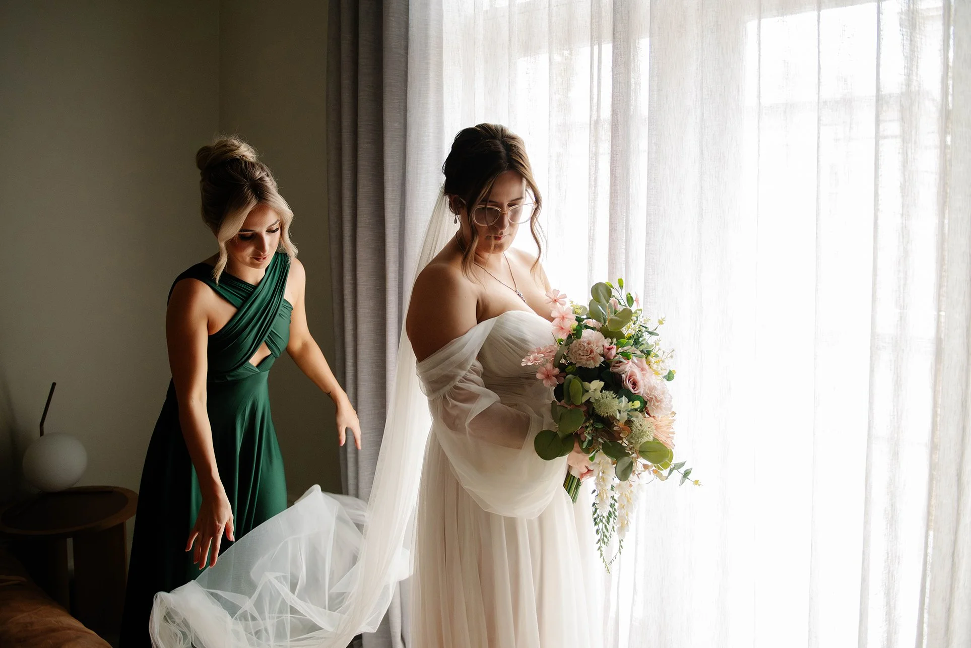 bride-bridesmaid-helps-veil-window-bendigo.jpg