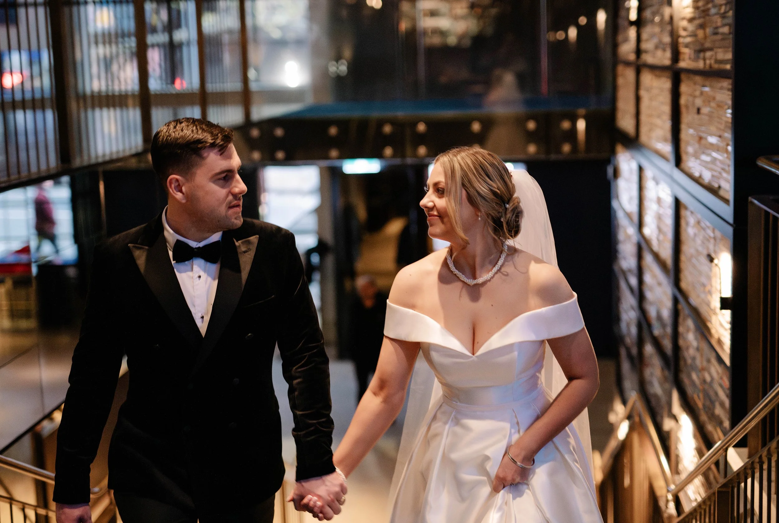 close up view of bride and groom looking at each other and smiling