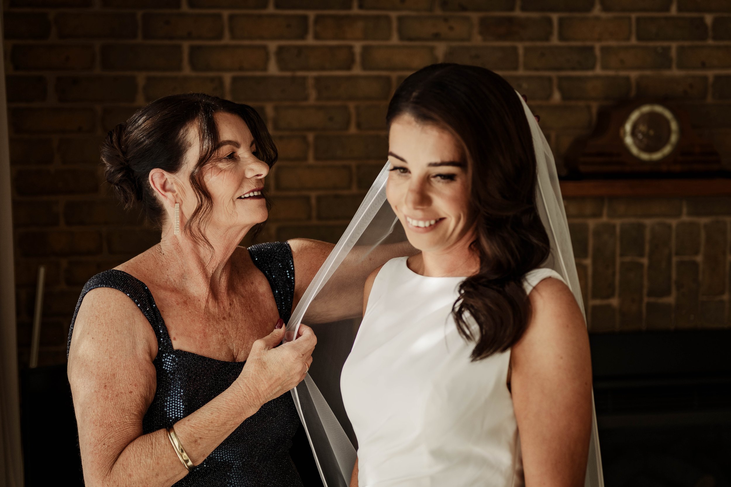 Mother of the bride placing the wedding veil while getting ready at Jason's Restaurant Beaconsfield Victoria