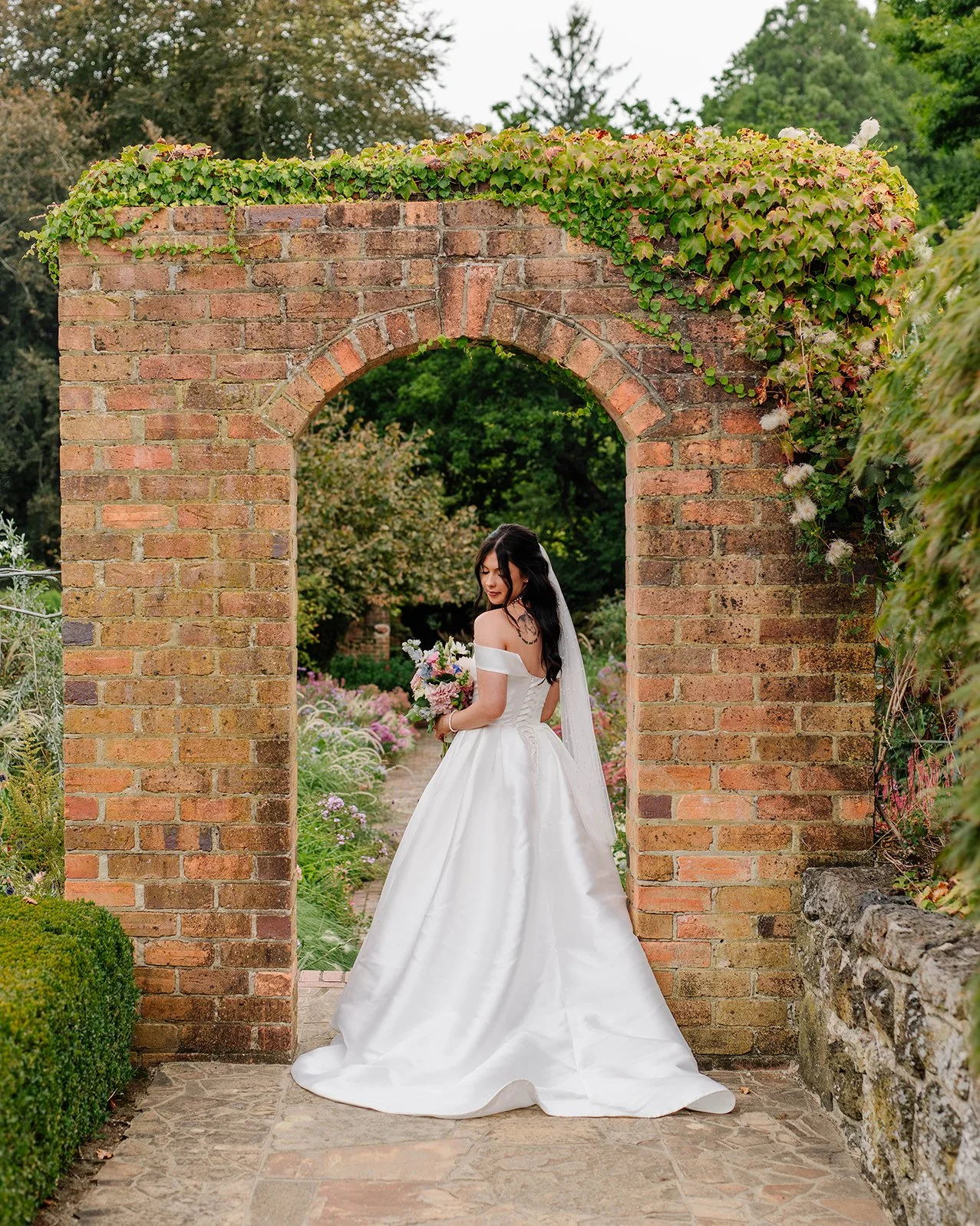 bride-blooks-down-under-arch-cloudehill.jpg