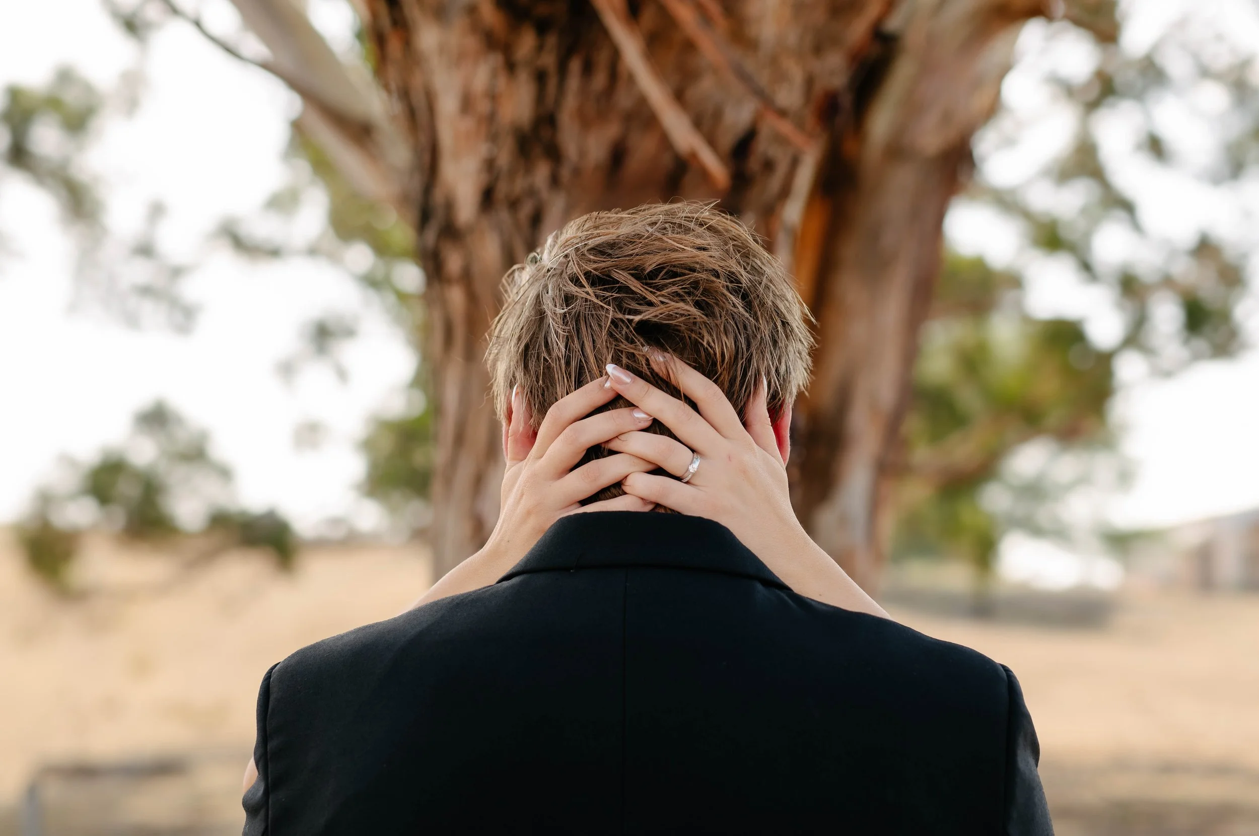 ballarat-brides-hands-clasp-grooms-neck.jpg