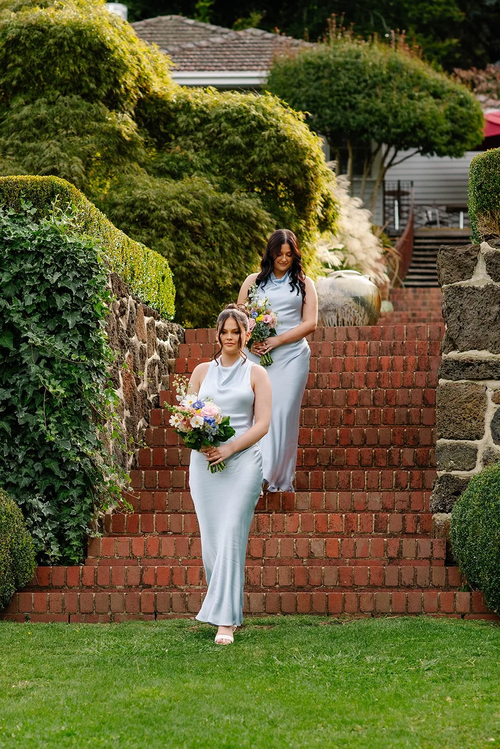 bridesmaids-walk-stairs-wedding-cloudehill-gardens.jpg