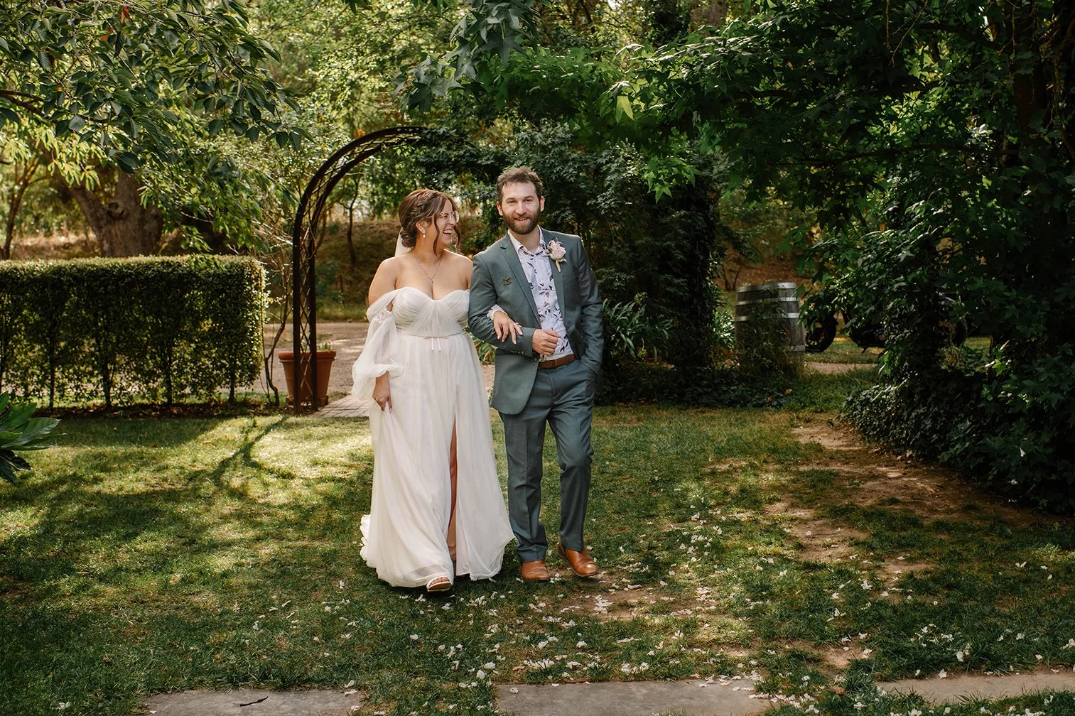 couple-walk-talk-candid-chateau-dore-garden.jpg