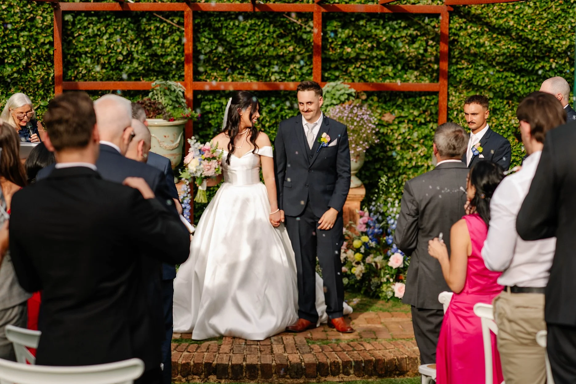 bride-groom-smile-arbor-wedding-presentation-olinda.jpg