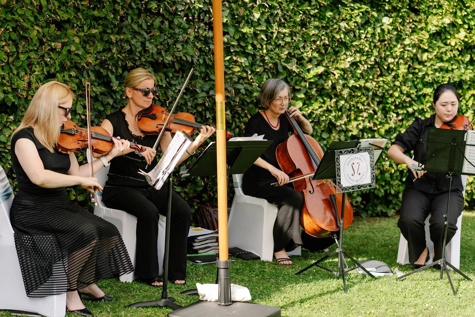 String quartet performing at an outdoor wedding ceremony at Cloudehill Gardens Dandenong Ranges