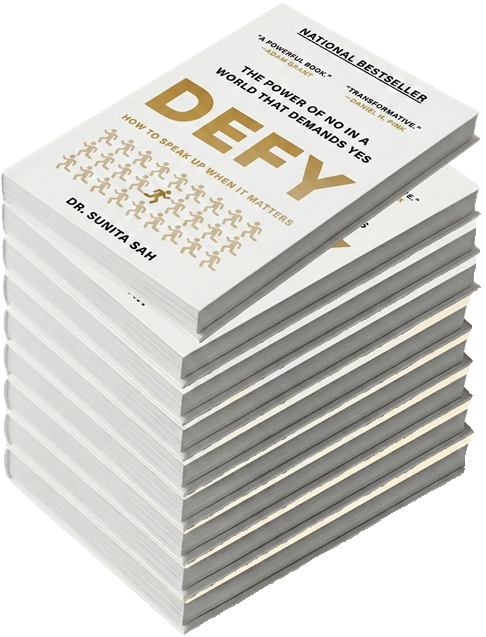 Stack of books titled "DEFY" by Dr. Sunita Sah, cover reads "The Power of NO in a World That Demands Yes."