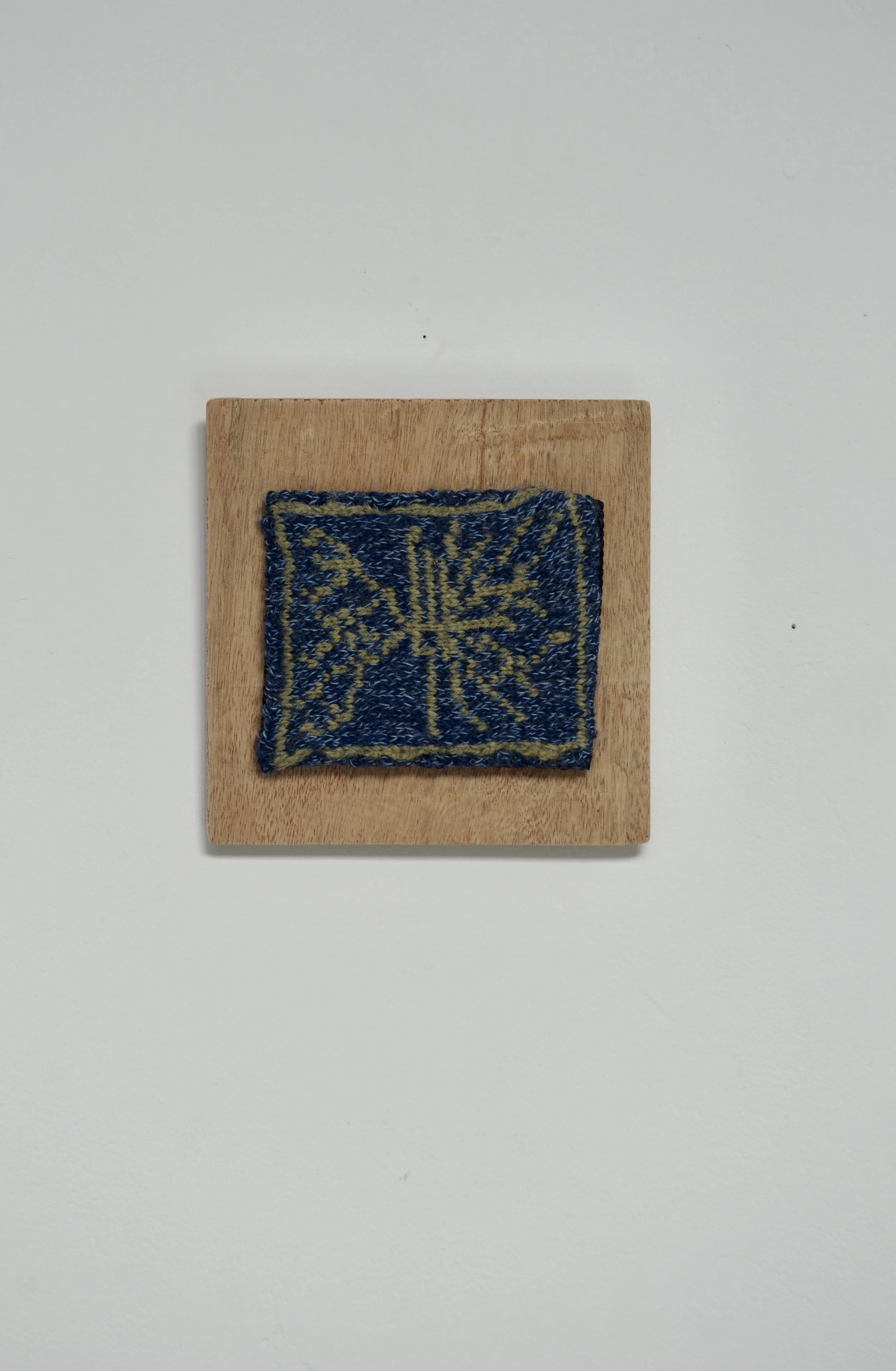 Top of Tree, 2025. Knitted wool mounted on wood. 7x7 inches (including frame). 