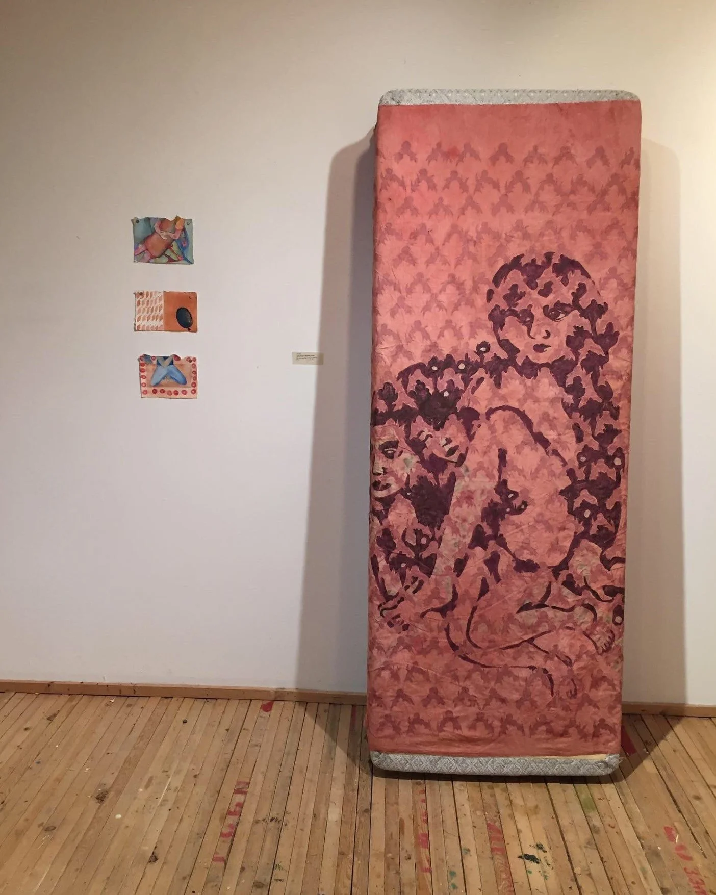 Cramped, Resting, 2022. Natural and synthetic dyes and prints on linen; synthetic mattress. 4x10 feet. 