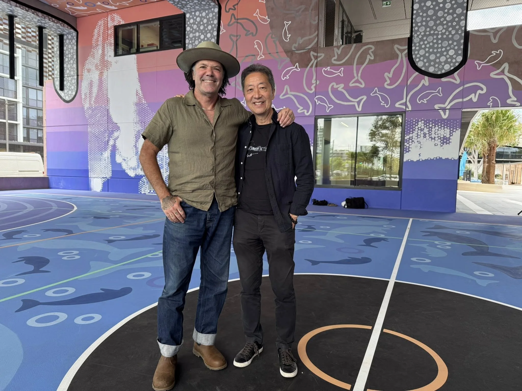 Art Atrium artist Blak Douglas at the launch of his new commissioned public art installation at the basketball court at the new Green Square Public School at Zetland with Clover Moore AO.