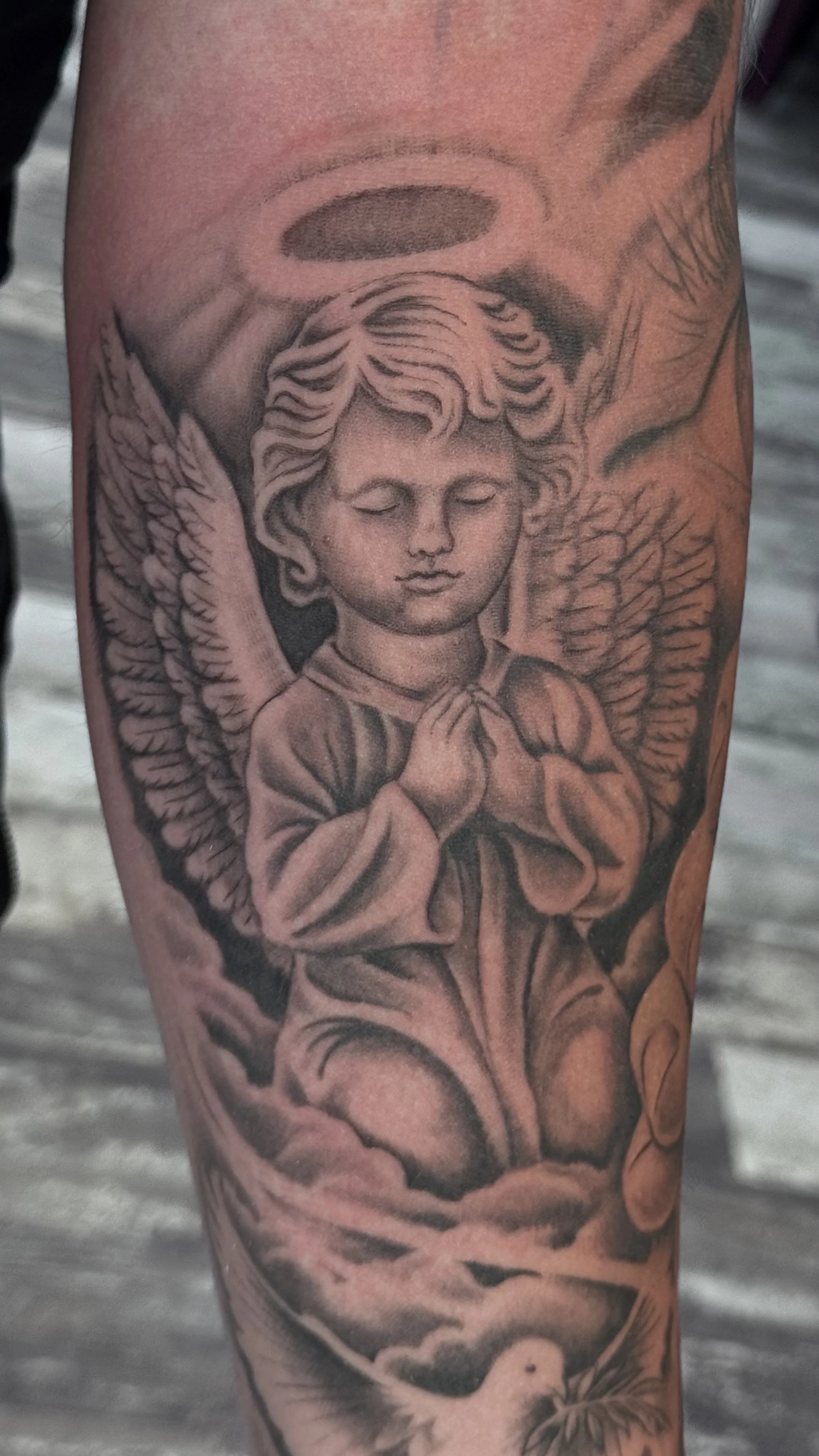 black and gray angel tattoo