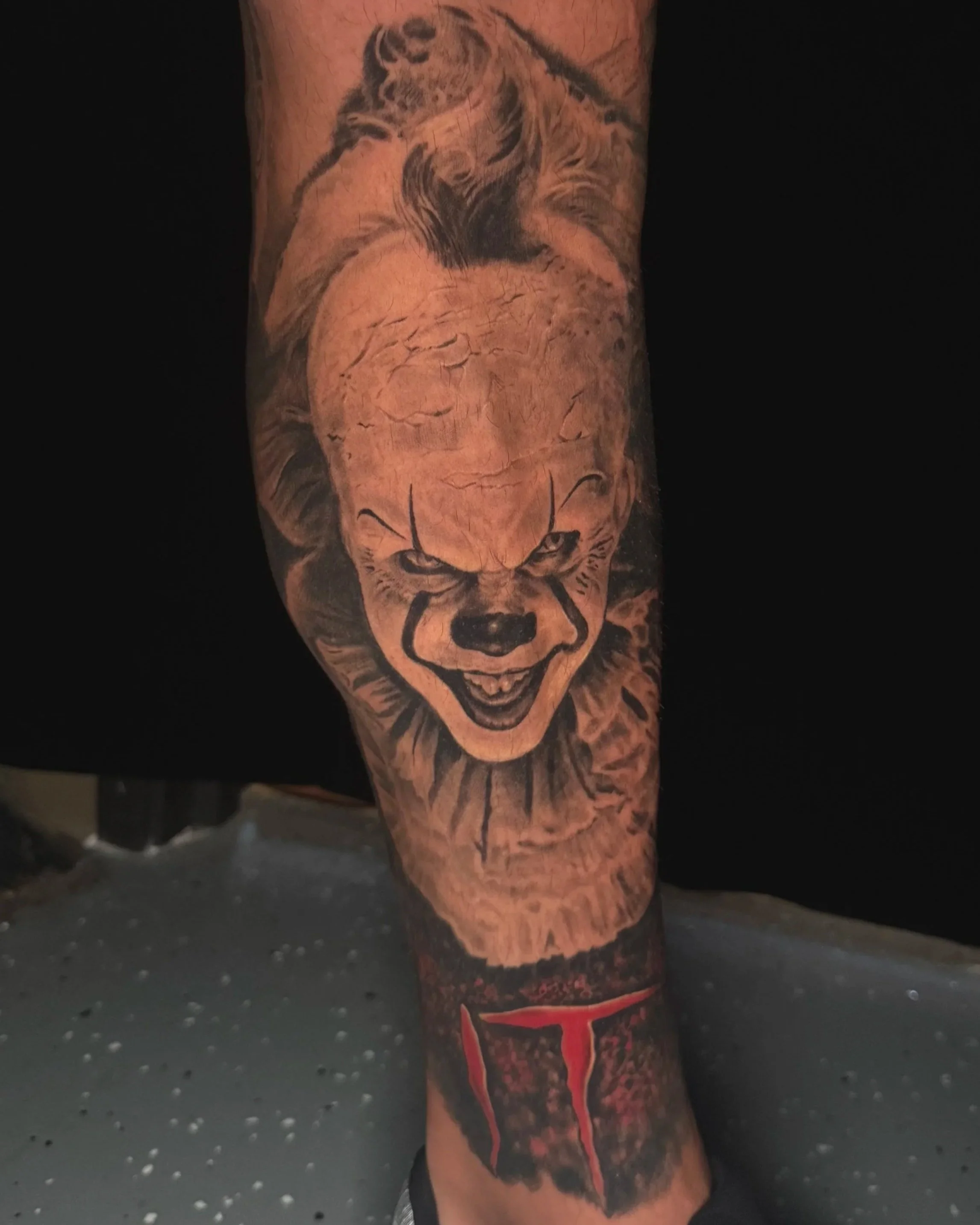 IT tattoo pennywise tattoo horror portrait black and gray healed