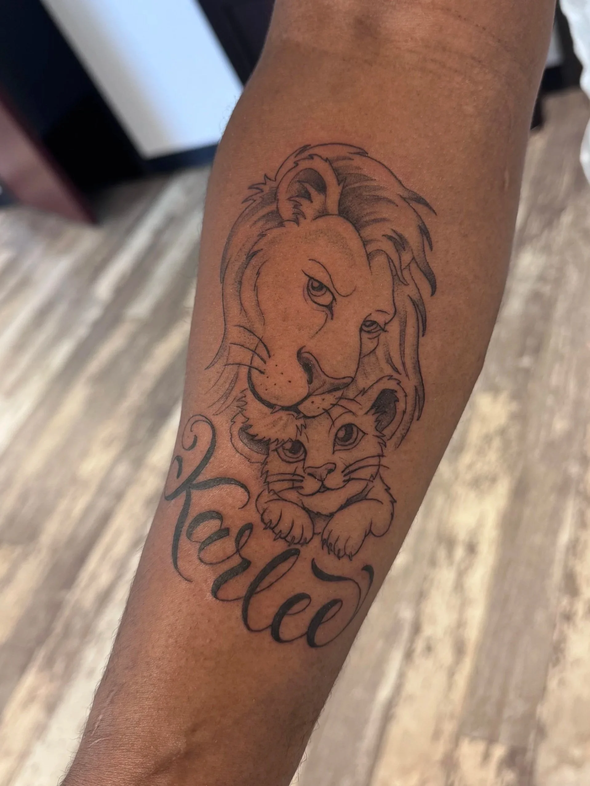 Illustrative Lion Tattoo on black person