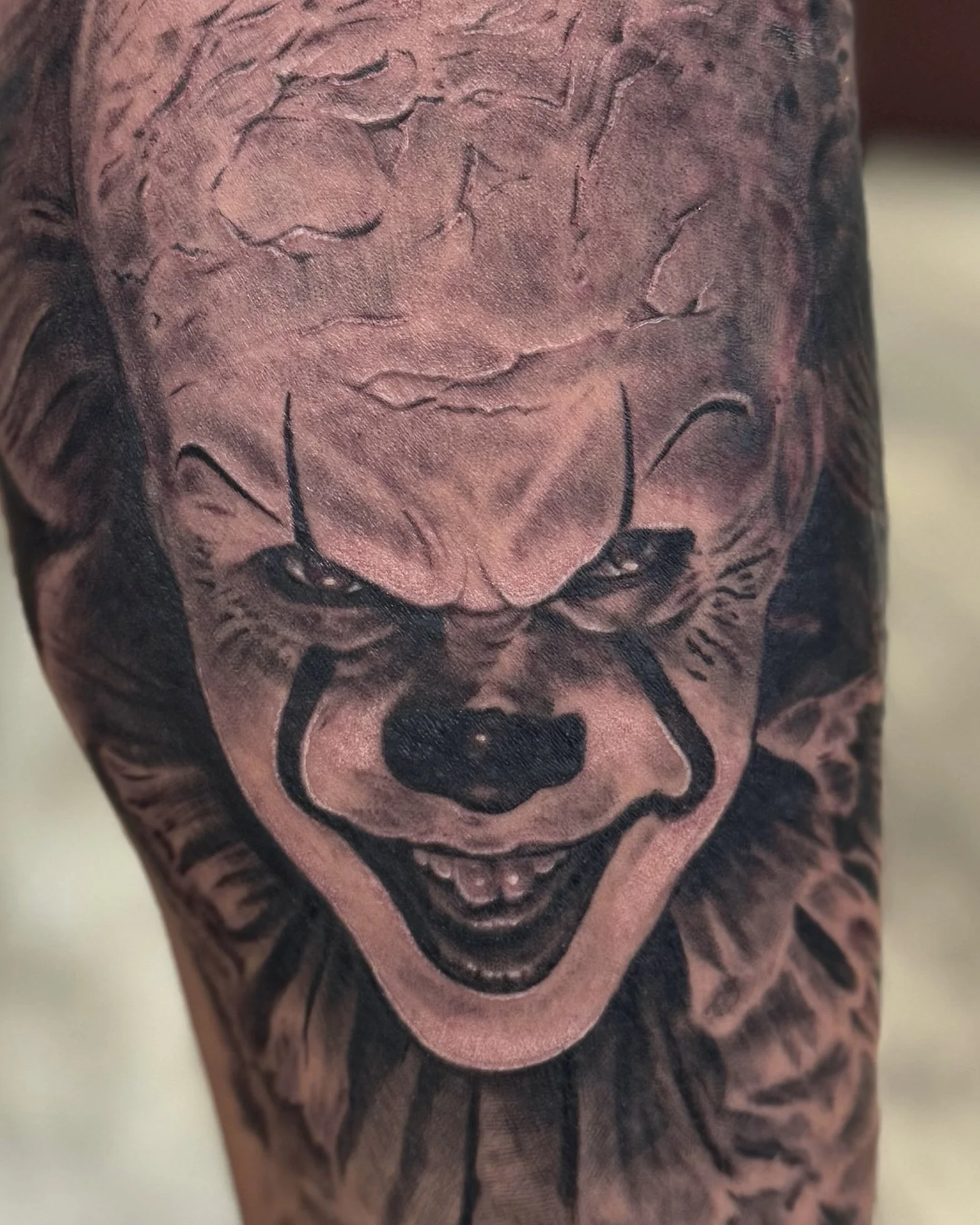 Pennywise close-up tattoo horror portrait