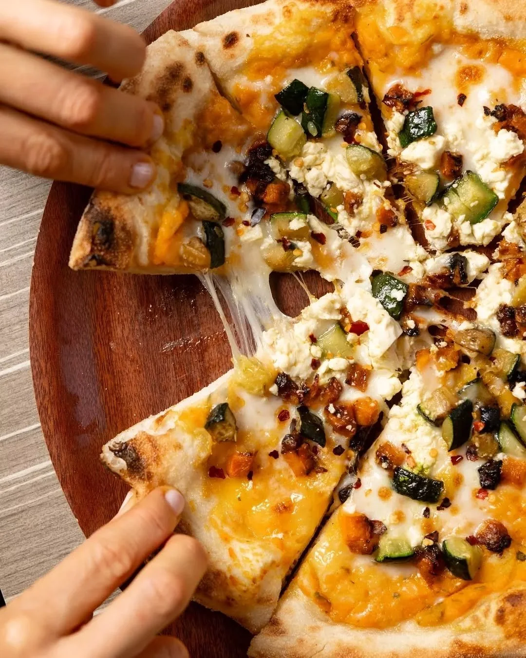 Our wood-fired Zucca pizza topped with pumpkin, zucchini, feta, sage and a hint of chilli 🌶️ Perfect with an icy cold drink in hand. Who are you sharing it with?

#therawson #therocks