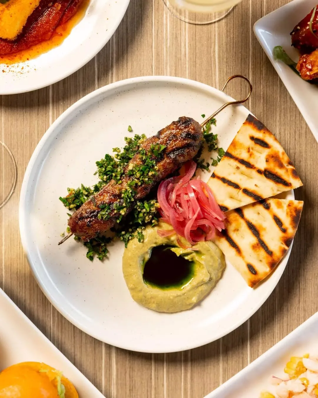 Perfectly spiced lamb kofta paired with smoky baba ghanoush, millet tabouli and warm flatbread. 

#therawson #therocks