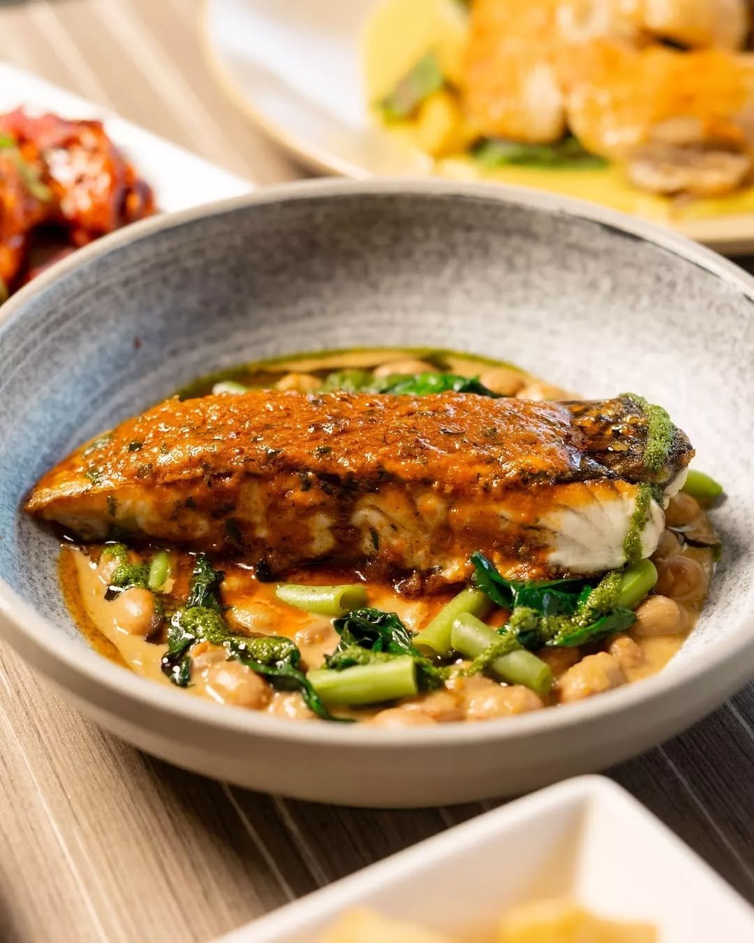 Your perfect meal is waiting. Grilled barramundi with prawn bisque butter, served with borlotti beans and salsa verde. Fresh, comforting and a favourite on our menu.

#therawson #therocks