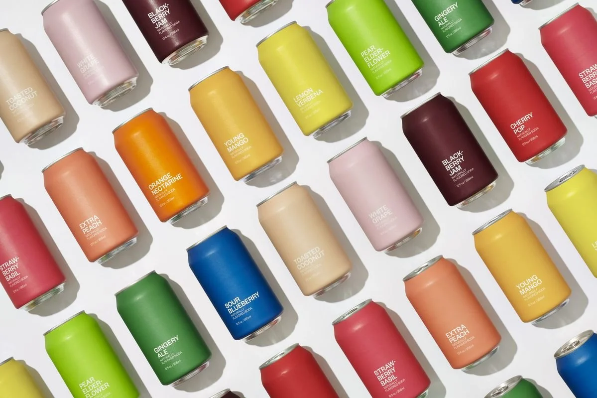 A collection of drinks cans in vibrant and different colours and flavours