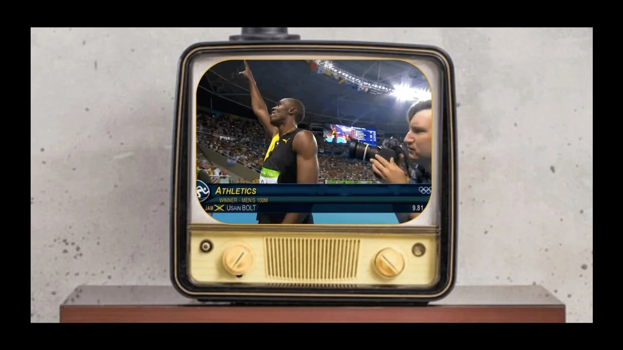 Olympic champion, Usain Bolt winning the gold medal again at the Olympics on TV
