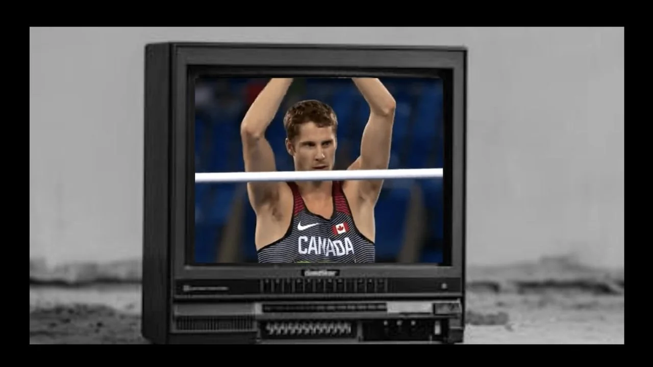 Canadian high jumper and Olympic gold medalist, Derek Druin celebrating after clearing the bar, pictured on TV