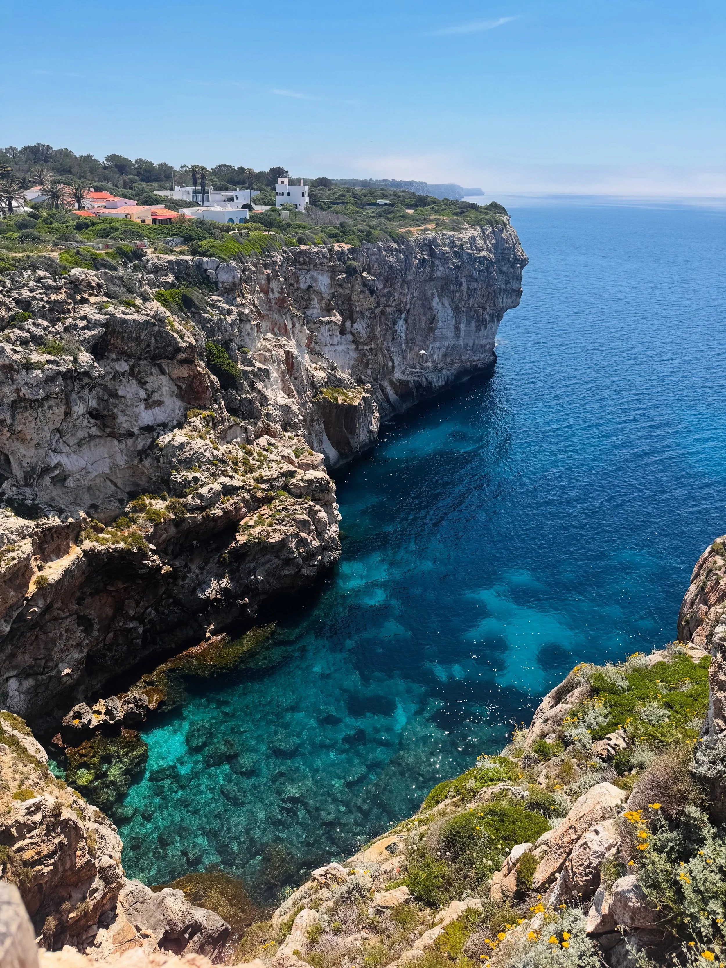 Perched above the coastline in Cala&rsquo;n Porter&hellip; views like this don&rsquo;t even feel real 🌊✨

Endless shades of blue, dramatic cliffs, and total peace &mdash; this is what waking up in Menorca should look like 💙

Imagine your morning co