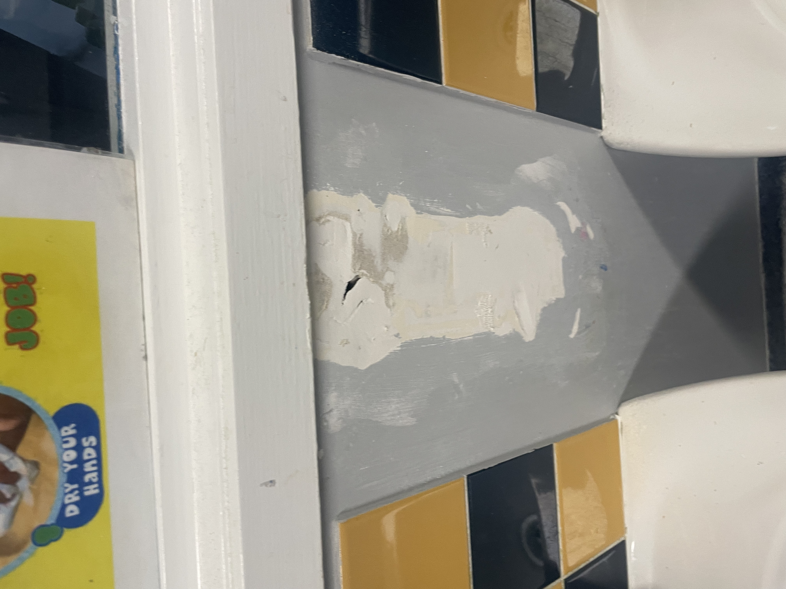 A previous handyman attempt at repairing the wall