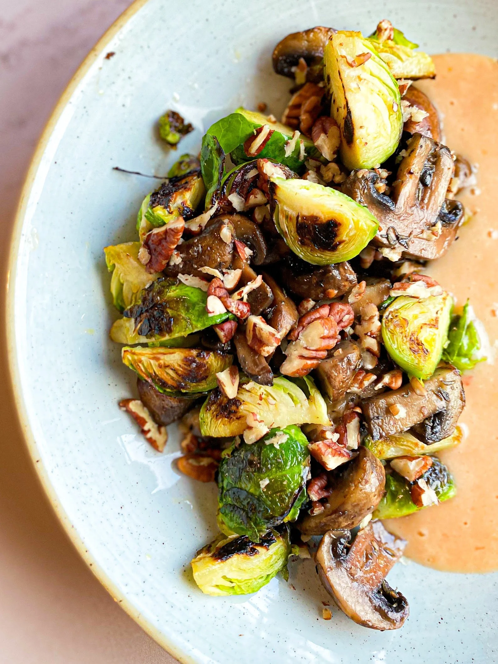 Brussels sprouts charred with walnuts and mushrooms