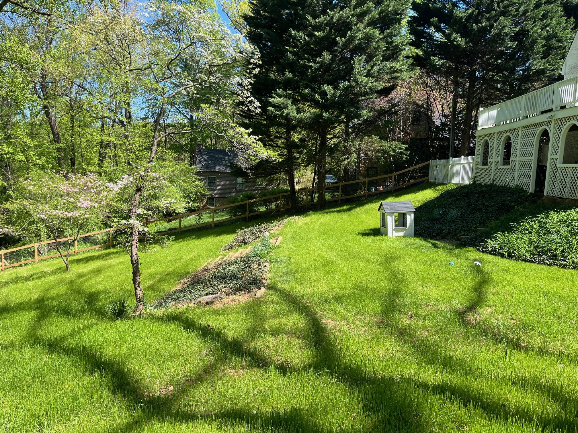 Land transformation project in Charlottesville - after image. Project included custom fencing and landscape timber steps.