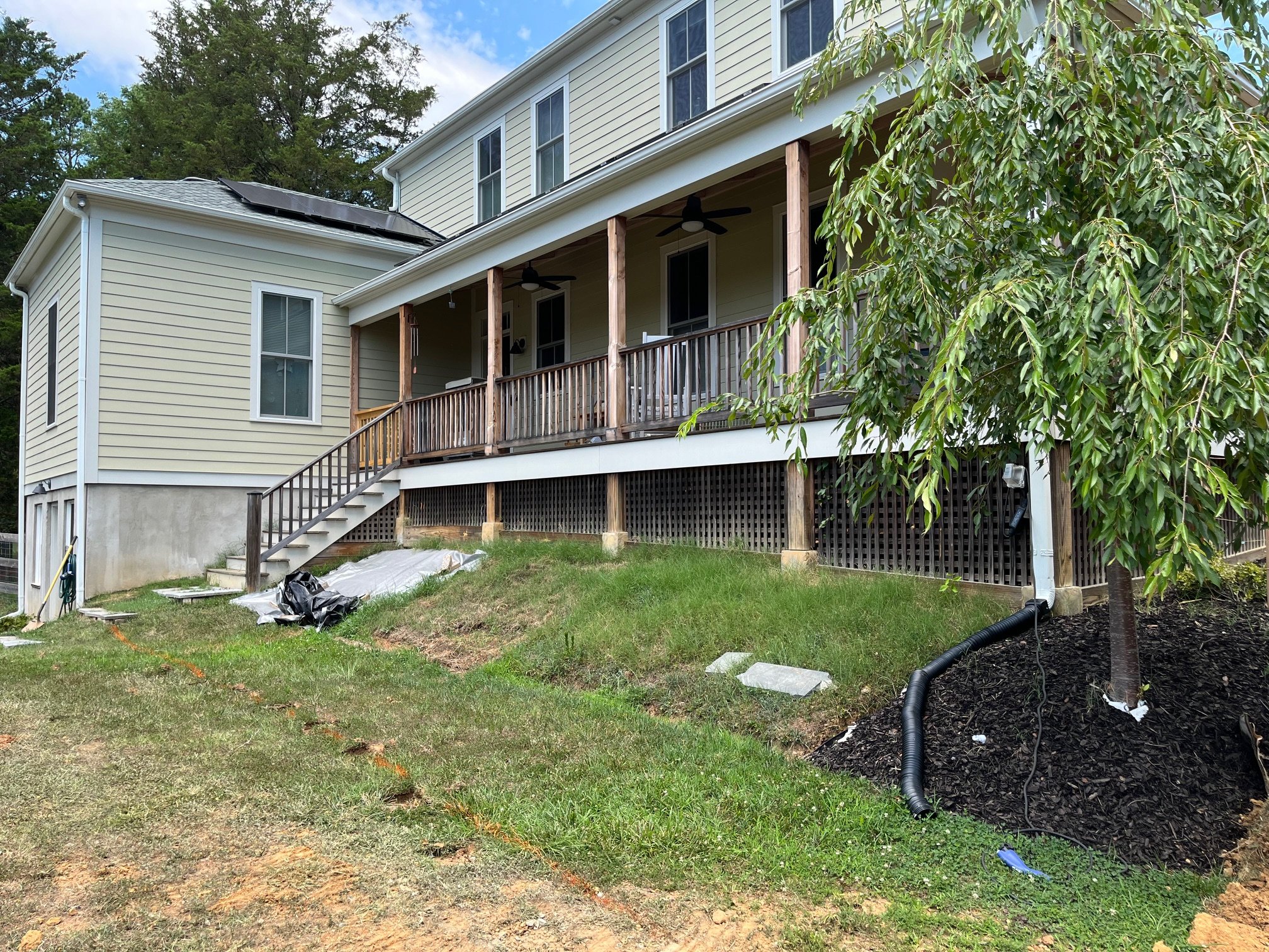 Bluestone walkway and retaining wall installation in Charlottesville - before image