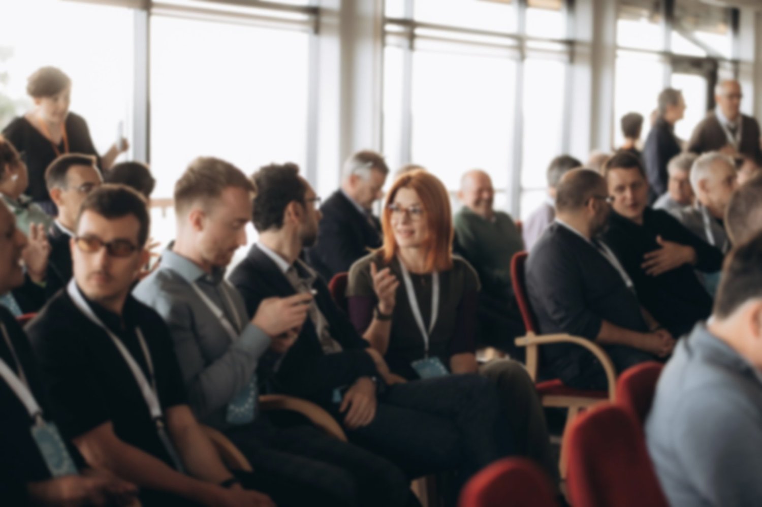 Members talking and laughing together between sessions at a CEO CF summit.