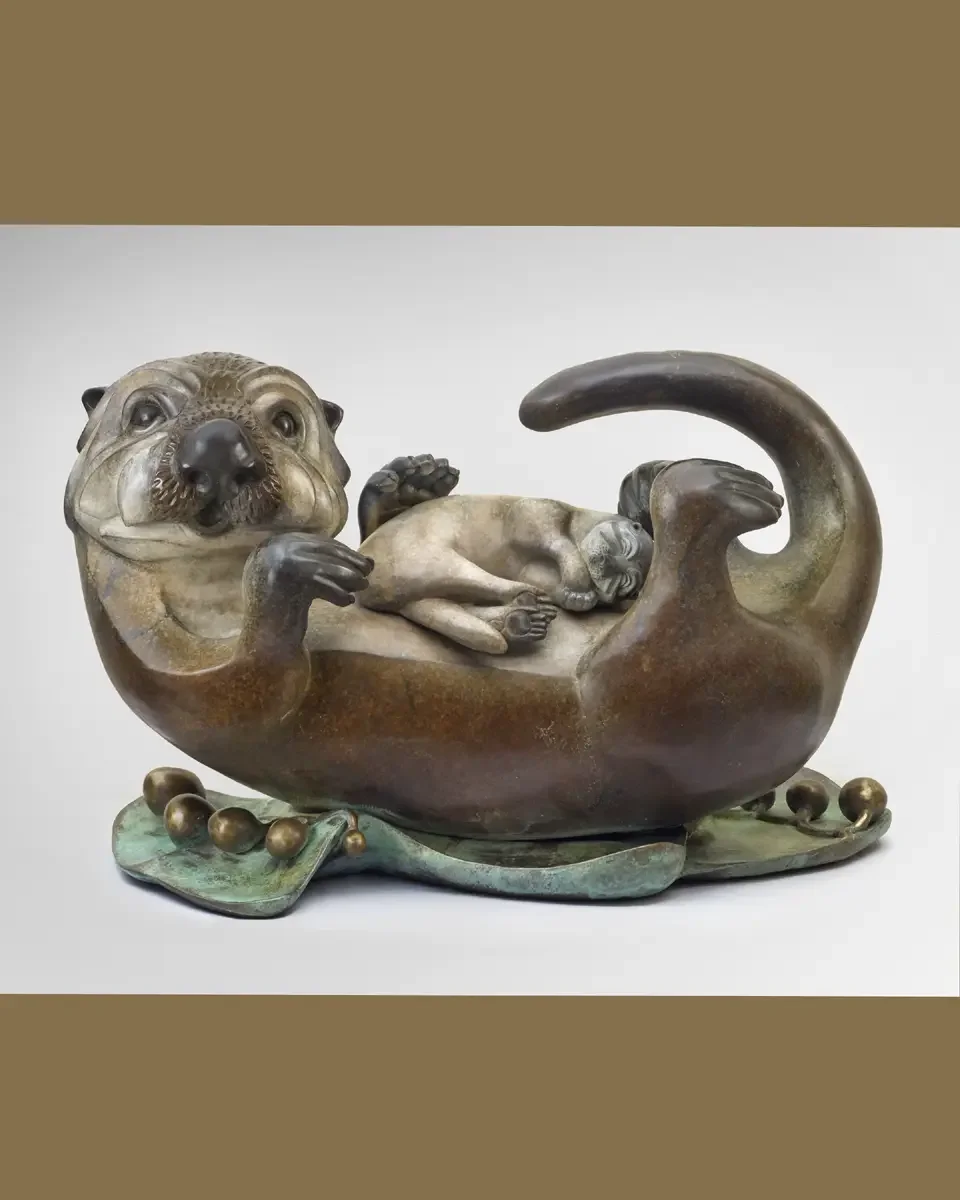 Sculpture of an otter mother and baby by Pokey Park