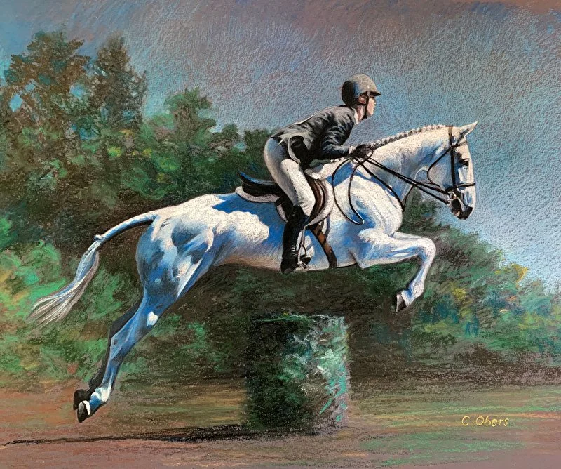 Grey horse and rider jump over a hedge