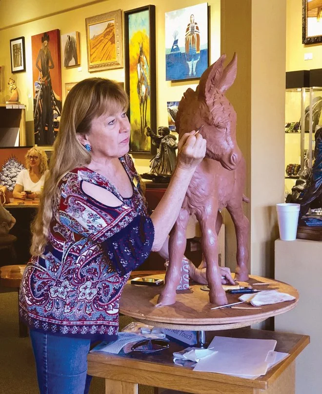 Syri Hall sculpting burro foal, Francesca