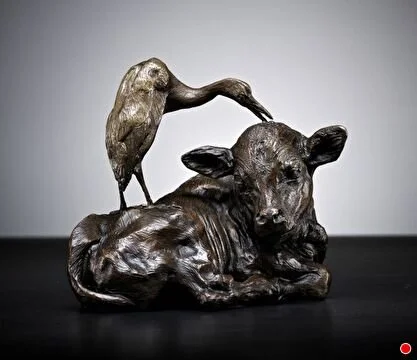 Sculpture of egret picking ticks off of a calf by Burnet Venosdel