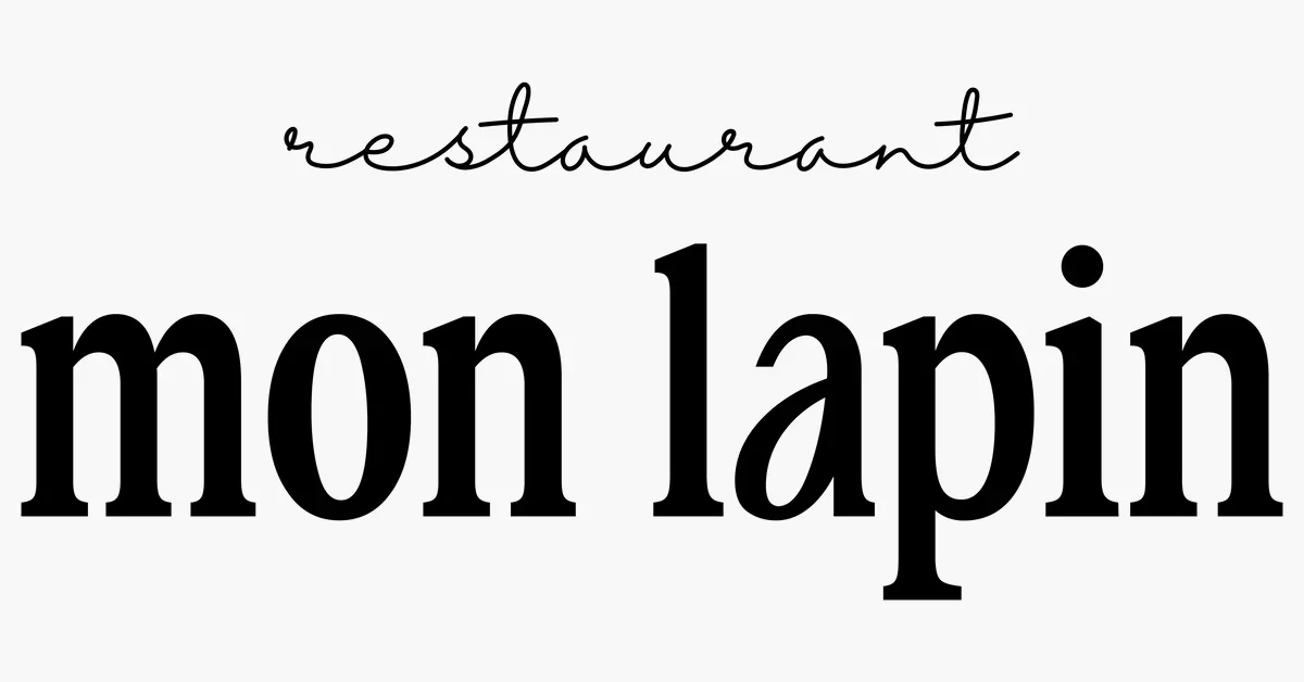 Text in black and cursive font saying "restaurant" and in bold, larger font saying "mon lapin" on a white background.
