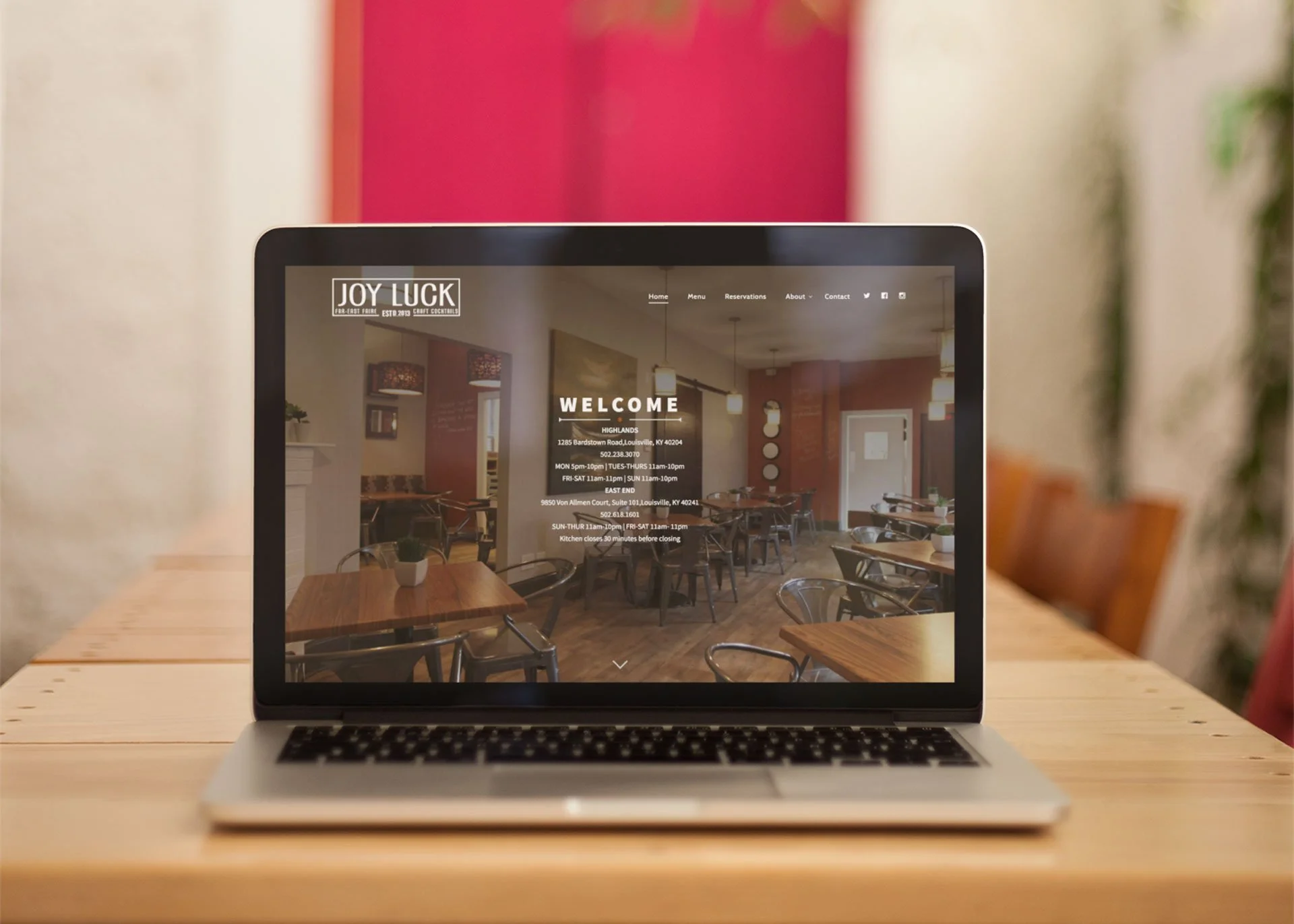 mockup-of-a-macbook-standing-on-a-wooden-table-a21008.jpg