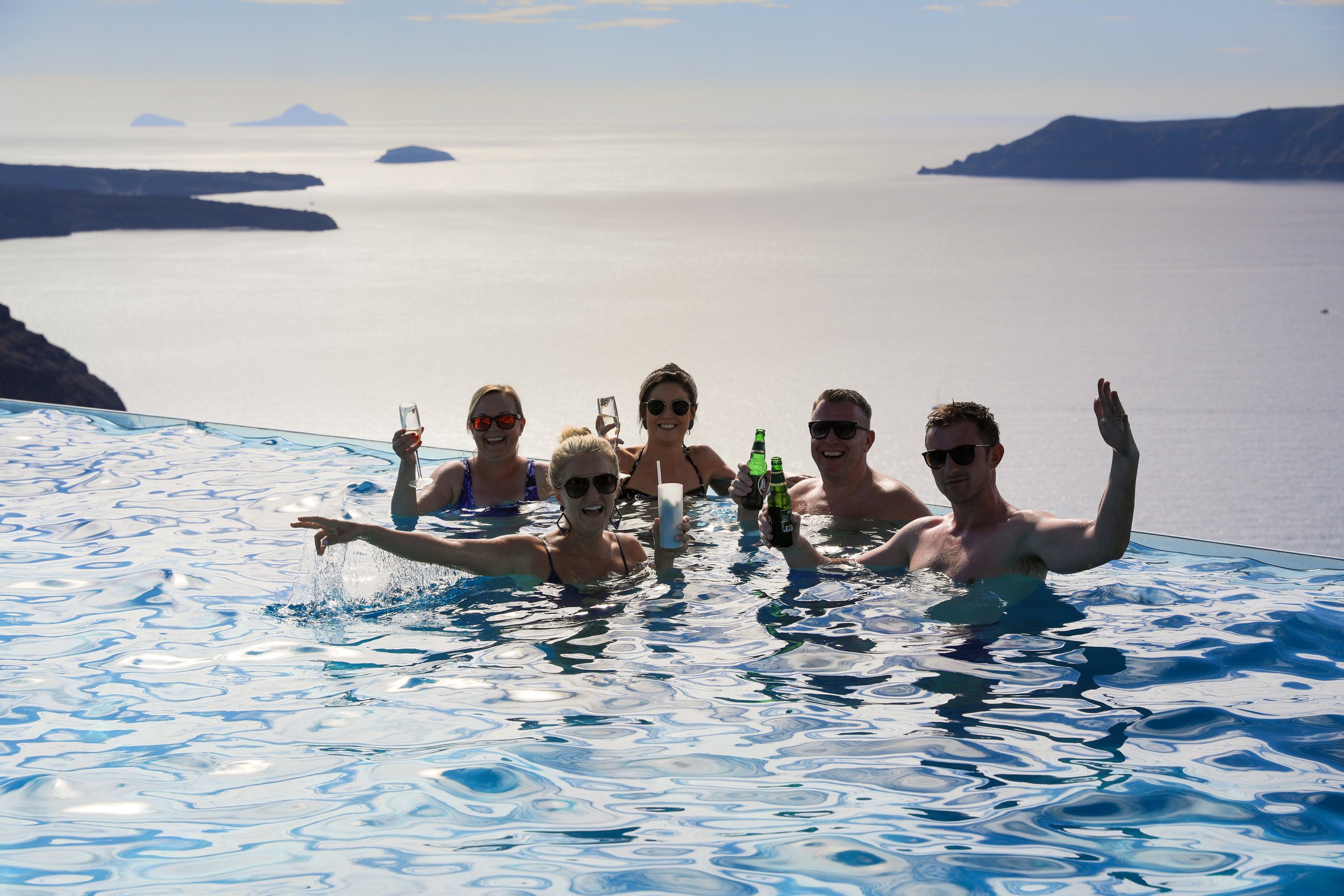 Wedding guests enjoying a pool gathering during a multi-day wedding in Greece