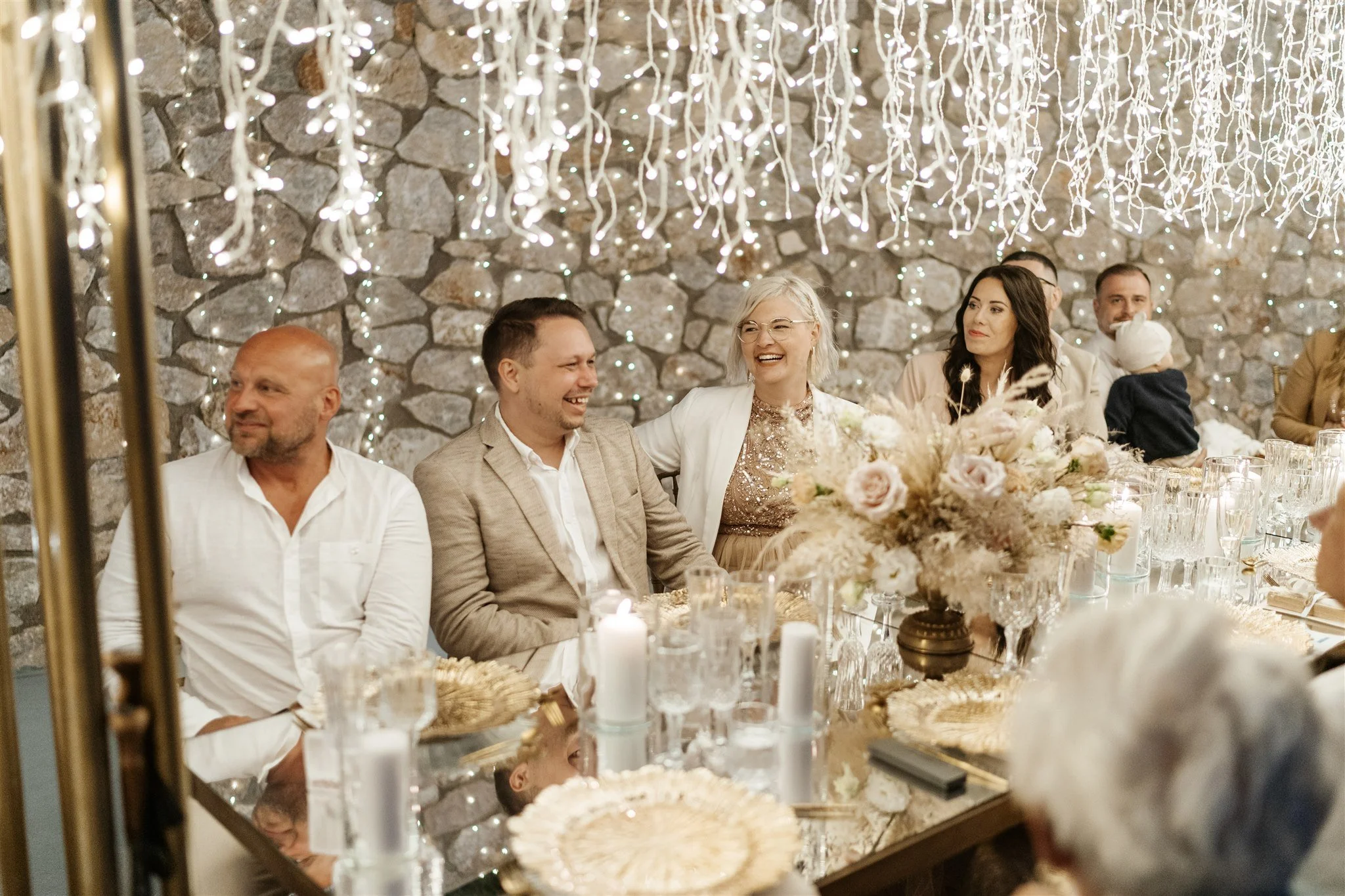 Wedding guests enjoying an elegant dinner celebration in Greece