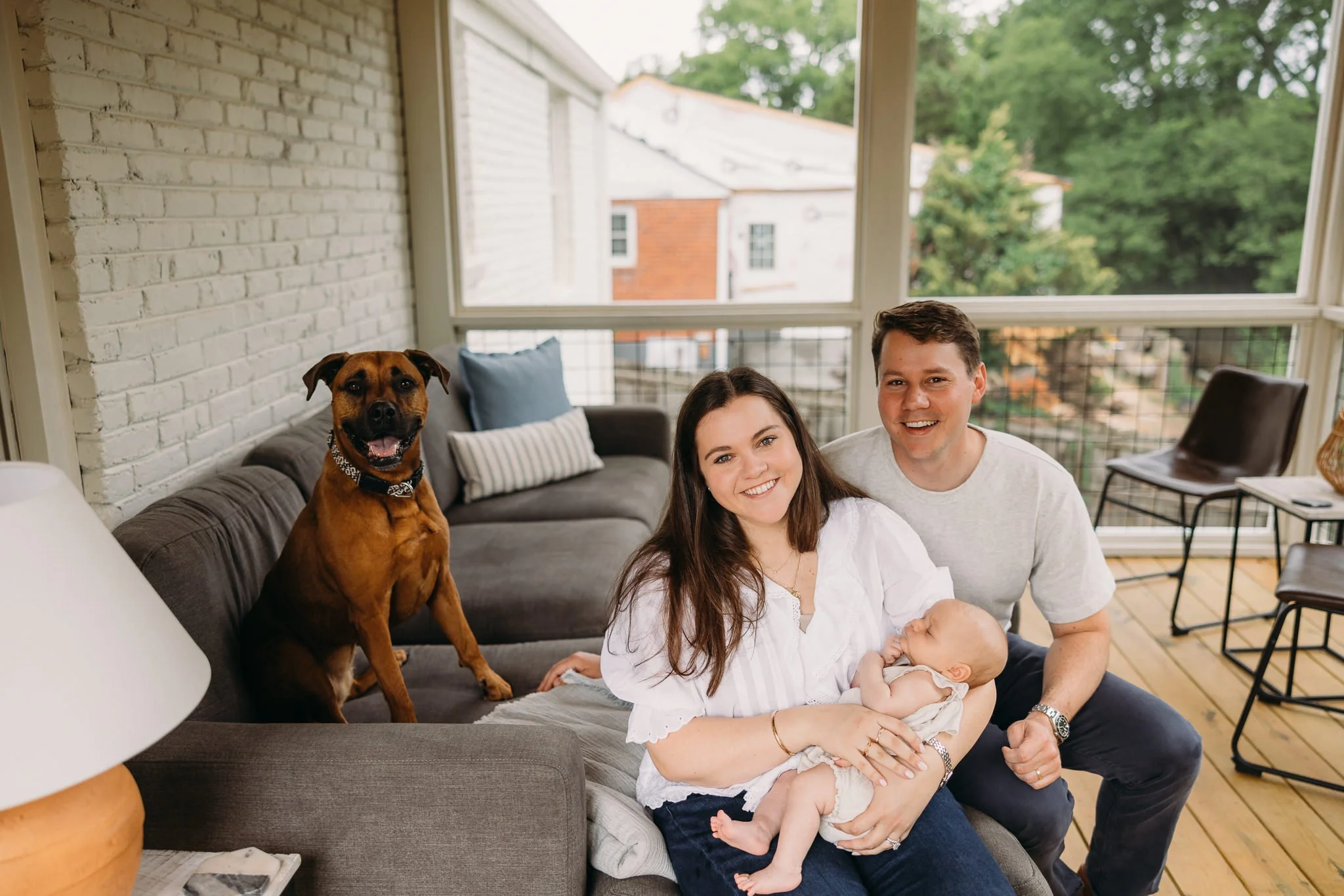 In-home newborn session with family dog, Nashville lifestyle newborn photographer.