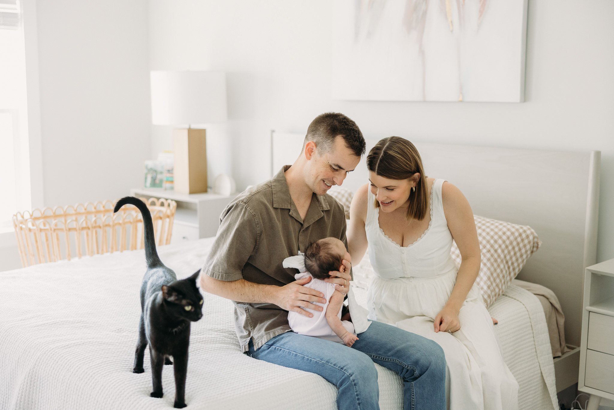 Cat near newborn baby during in-home lifestyle photography session, Nashville.